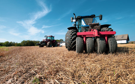 Danish agricultural farm tractor in field on a sunny dayの写真素材