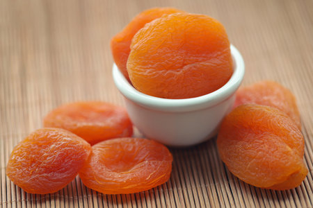 Dried apricot closeup in a bowlの写真素材
