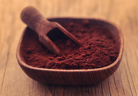 Cacao Powder in a bowl with wooden scoopの写真素材