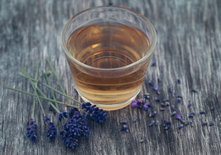 Lavender tea with flowers in natural surfaceの写真素材