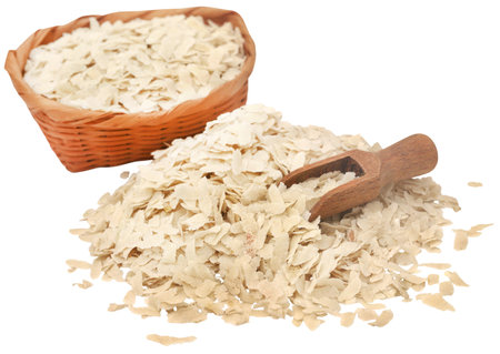 Flattened rice of South East Asia with wooden scoopの写真素材