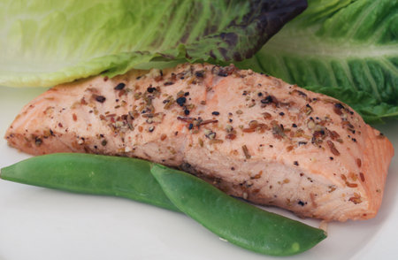 Trout fish piece cooked with oil black pepper and other ingredientの写真素材