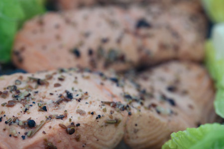 Trout fish pieces cooked with oil black pepper and other ingredientの写真素材