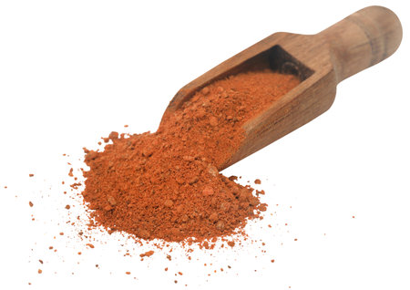 Cinnamon ground powder in a wooden scoopの写真素材