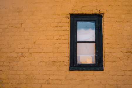 Old window with copy space of yellow brick wallの写真素材