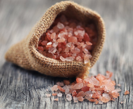 Himalayan pink salt in jute sackの写真素材