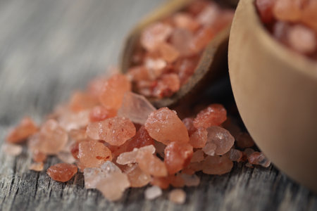 Himalayan pink salt  on wooden surfaceの写真素材