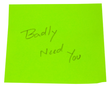 Hand written Badly need you in a green paperの写真素材