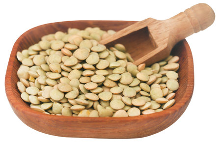 Green lentils in a wooden bowlの写真素材