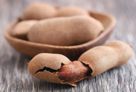 Sweet tamarind in natural wooden surfaceの写真素材