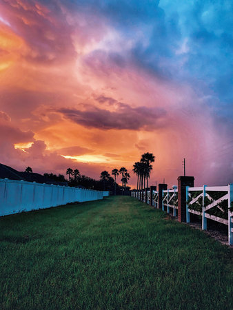 Summer sunset with incoming storm