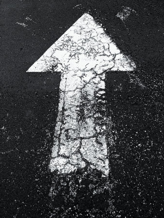 arrow on the street showing direction