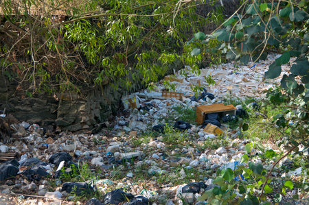 Huge open-air garbage landfill in a riverbed near Sihanoukville, Cambodia