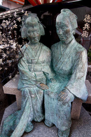 OSAKA, JAPAN - SEPTEMBER 22, 2018 : Portrait of Ohatsu and Tokubei Statue at the Tsuyoten Temple (Ohatsu Tenjin Shrine)のeditorial素材