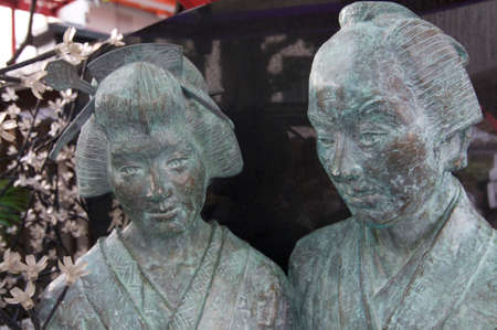 OSAKA, JAPAN - SEPTEMBER 22, 2018 : Portrait of Ohatsu and Tokubei Statue at the Tsuyoten Temple (Ohatsu Tenjin Shrine)のeditorial素材