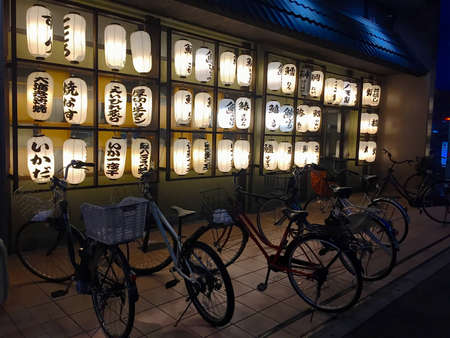 Hyogo, Kobe, Japan - 12th October 2018 : Beautiful view at night of a Traditional Japanese Restaurant exterior, decorated with many paper lanterns located in Hyogo, Japanのeditorial素材