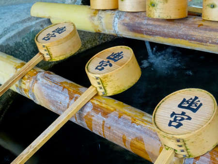 Awaji, Hyogo, Japan - 17th September 2018 : Picture of some ladle in a ChÅzubachi that are used to purify by the worshippers before entering a shrine. This are located at the Izanagi Shrineのeditorial素材