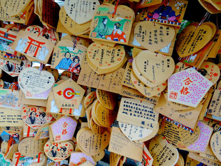 Osaka, Kansai, Japan - 22nd September 2018 : Close up picture of many Ema's (votive plaques) hanging at the Tsuyunoten Shrine in Osakaのeditorial素材