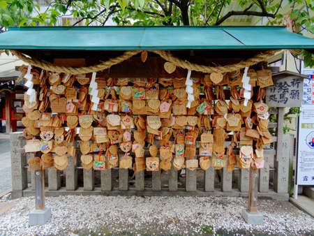 Osaka, Kansai, Japan - 22nd September 2018 : Picture of many Ema's (votive plaques) hanging at the Tsuyunoten Shrine in Osakaのeditorial素材