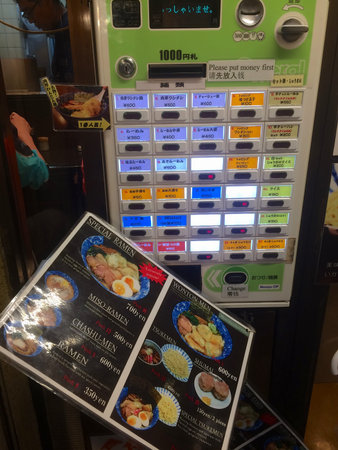 Asakusa, Tokyo, Japan - 6th July 2018 : View of a menu and a ticket machine that can be found at the...