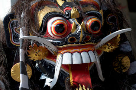 Close up picture of a typical Balinese barong mask located at the famous Ubud Art Market in Bali, Indonesiaの写真素材
