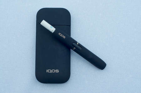Caslano, Ticino, Switzerland - 26th July 2019 : Picture of IQOS a new heat-not-burn tobacco product technology produced by Philip Morris International in Neuchatel, Switzerlandのeditorial素材