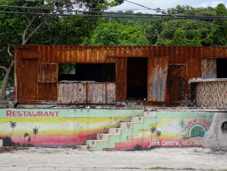 Ochos Rios, Saint Ann, Jamaica - 22nd June 2017 : View of an abandoned and rusty Jerk Center restaurant near Ochos Rios area in Jamaicaのeditorial素材
