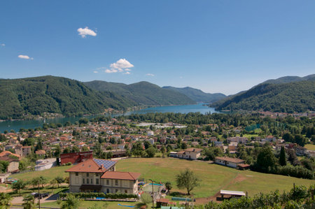 Beautiful panoramic view over the village of Magliaso and the Lugano lake in the background, located...