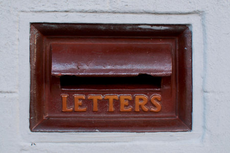 View of an old typical australian mail box integrated in a white wall with the inscription Letters. This mail box was captured in the New Farm district in Brisbaneの写真素材