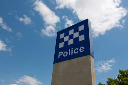 Brisbane, Queensland, Australia - 29th October 2019 : View of the australian Police sign against a blue sky located outside a police station in Greenslopes, Brisbane, Australiaのeditorial素材
