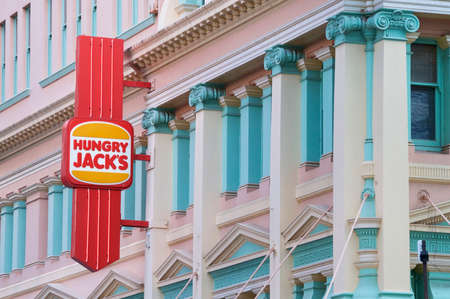 Brisbane, Queensland, Australia - 21st January 2020 : Hungry Jack's logo hanging from the facade of the restaurant in Queenstreet Mall in Brisbane, Australiaのeditorial素材