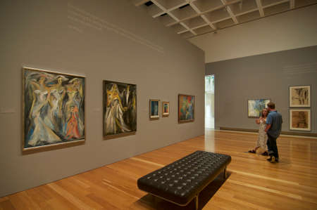 Brisbane, Queensland, Australia - 15th January 2020 : Indoor view of an Art Gallery in Brisbane with people enjoying some beautiful paintingsのeditorial素材