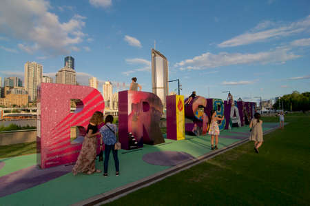 Brisbane, QLD, Australia - 29th February 2020 : Tourist in front of the Brisbane sign monument with the beautiful city skyline in the background. The sign was installed for the G20 summit in 2014のeditorial素材