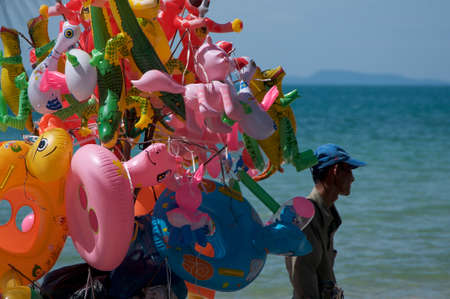 Otres Beach, Sihanoukville, Cambodia - 29th December 2018 : Typical swimming ring vendor that can be found on the beautiful beaches of Otres near Sihanoukville in Cambodiaのeditorial素材