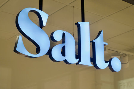 Lugano, Switzerland - 26th November 2020 : Salt Mobile sign hanging in front of a store in Lugano....