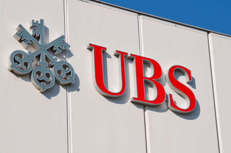 Morbio Inferiore, Ticino, Switzerland - 10th March 2021 : UBS Bank logo sign hanging on a building facade in Morbio Inferiore. UBS is one of the leading banks in Switzerland and in the worldのeditorial素材