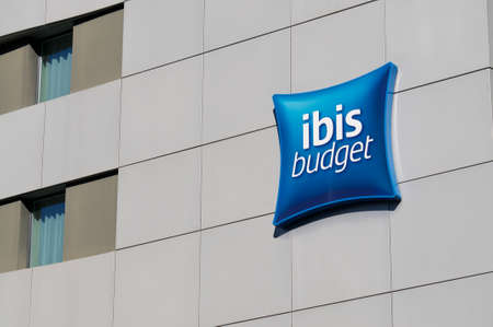 Lugano, Ticino, Switzerland - 16th March 2021 : Ibis Budget Hotels sign hanging on the hotel building in Paradiso, Switzerland. is a brand of economy hotels owned by Accorのeditorial素材