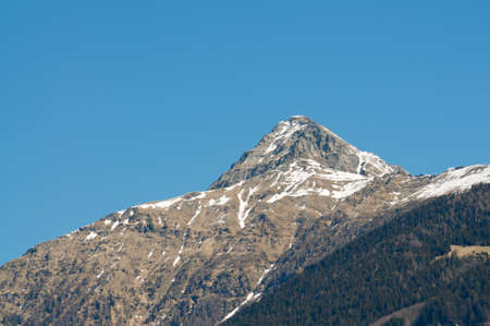 View of the Pizzo Claro (also known as Visagno Mountain) mountain with remaining snow, on a spring day in Ticino, Switzerlandの写真素材