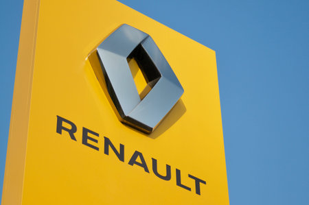 Manno, Ticino, Switzerland - 27th March 2021 : Yellow Renault sign against blue sky in Switzerland. Renault is a French multinational automobile manufacturer established in 1899のeditorial素材