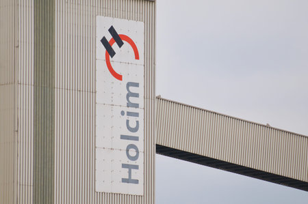 Siggenthal, Aargau, Switzerland - 18th April 2021 : Holcim company sign hanging in front of a building in Switzerlad. Holcim is a Swiss-based global building materials and aggregates companyのeditorial素材