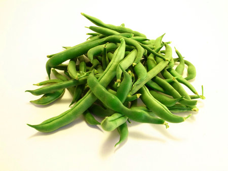 A pile of green beans isolated on a white background.