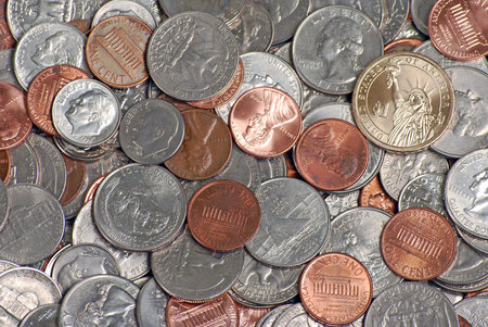 Loose change with a dollar coinの写真素材