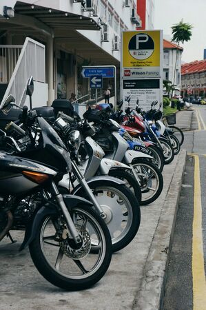 Motorbikes parked neatlyの素材