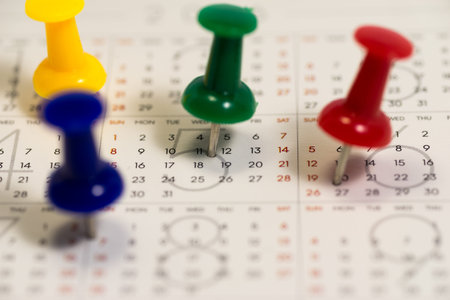 Colorful pins on calendar
