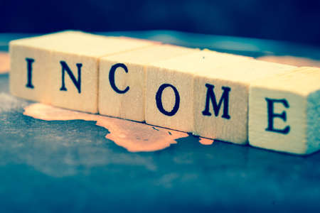 INCOME on grunge world mapの写真素材
