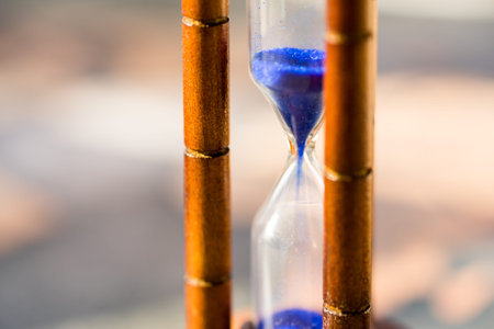 Hourglass against grunge world map