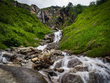 Charming scenery of waterfalls and picturesque meadows of Alps in National park Hohe Tauern near Kaprun, Austria, Europe.の写真素材