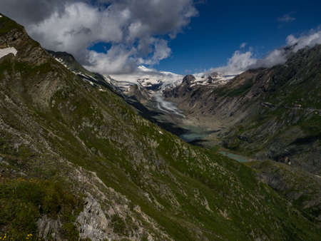 The best scenic view to the highest mountain in Austria, Grossglockner with his glaciers cover with snow and unique lakes under him in Hohe Tauern national park, near Heiligenblut, Austria, Europe.の写真素材
