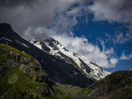 Dramatic and charming view to the highest mountain in Austria, Grossglockner with glaciers cover with snow. Hohe Tauern national park, near small city Heiligenblut, Austria, Europe.の写真素材