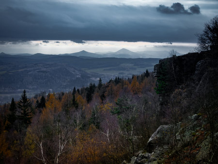 Amazing dark scenery and view to the deep valleys from top of mountains in north of Czech Republic.の写真素材